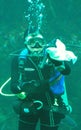 Scuba diver at Monterey Bay Aquarium cleaning tank Royalty Free Stock Photo