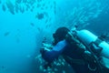 Scuba diver recording underwater video
