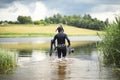 A scuba diver in a wet suit prepares Royalty Free Stock Photo