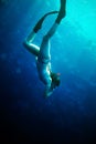 Scuba diver woman in blue water. Royalty Free Stock Photo