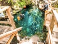 Scuba divers enter the clear blue water at Paradise Springs, Ocala, Florida