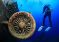 SCUBA divers explore the wreck of an aircraft Royalty Free Stock Photo