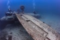 SCUBA divers explore the wreck of an aircraft Royalty Free Stock Photo