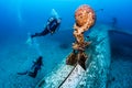 SCUBA divers explore the wreck of an aircraft Royalty Free Stock Photo