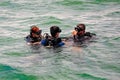 Scuba divers getting ready to dive deep down the ocean in Salvador, Bahia, Brazil