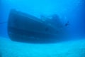 Scuba Divers and Large Shipwreck in Grand Cayman Royalty Free Stock Photo