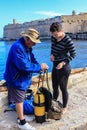 Scuba divers prepare their equipment before diving.