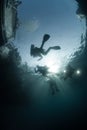 Scuba divers in silhouette Royalty Free Stock Photo