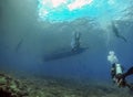 Scuba divers underwater in the clear waters of El Nido in Palawan Royalty Free Stock Photo