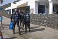 Scuba divers waliking in Puerto Calero