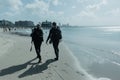 Scuba Divers Walking Beach Home