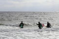 Scuba Divers Walking into the Ocean