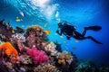 Scuba diving man exploring a breathtaking coral reef teeming with vibrant marine life, offering a captivating glimpse into the