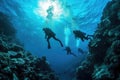 Scuba Diving Men in Blue Water, Diving in the Great Barrier Reef, Tropical Divers, Deep Underwater Royalty Free Stock Photo