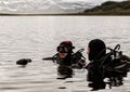 Scuba diving in a mountain lake, practicing techniques for emergency rescuers. immersion in cold water Royalty Free Stock Photo