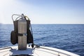 A scuba diving tank and gear standing on a boat Royalty Free Stock Photo