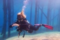 Scuba diving woman in the crystal clear water Royalty Free Stock Photo