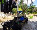 Scuba diving equipment resting under the sun on a sandy beach