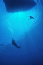 Scuba diver in blue water