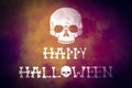 A scull on dark colorful yellow violet grunge background. Halloween greeting card.