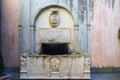 Sculpted old fountain in Sutri