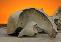 Sculpted rock formation and orange sky