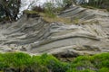 Sculpted rock formations create a beautiful cliff face along Wreck Beach in Vancouver, British Columbia