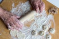 Sculpting of traditional Russian meat dumplings with minced meat Royalty Free Stock Photo