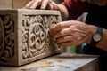sculptor, carving intricate design into stone block Royalty Free Stock Photo