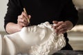 The sculptor conducts restoration work in a plaster workshop. Restoration of the gypsum head of Apollo