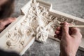 The sculptor creates a bas-relief. Plaster workshop. Close up. Selective focus