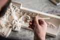 The sculptor creates a bas-relief. Plaster workshop. Close up. Selective focus