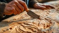 Sculptor hand working with wood carving with chisel making sculpture Royalty Free Stock Photo