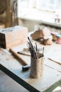 Sculptor`s art workshop details, srtist`s studio accessories Royalty Free Stock Photo
