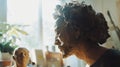 Sculptor working on clay portrait bust in sunlit studio Royalty Free Stock Photo