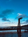 A Sculptural Bridge Artwork Stands On The Waterfront