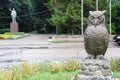 Sculptural composition of an Owl on the background of the monument to the leader of the proletariat in the village of Sychevo