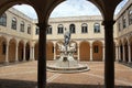 Sculptural group inside an arcaded courtyard