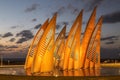 Sculptural group sails with changing colors at sunset in Ashdod