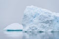 Sculptural iceberg shrouded in fog and floating in the waters of Antarctica Royalty Free Stock Photo