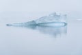 Sculptural iceberg shrouded in fog and floating in the waters of Antarctica Royalty Free Stock Photo