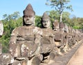 Sculptural stone group of guard soldiers at the gates of the ancient Angkor Wat is a temple complex in Cambodia Royalty Free Stock Photo