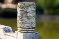 Sculptural stone pillars on the guardrail in a Chinese garden Royalty Free Stock Photo