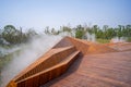 Angular Wooden Geometric Installation With Ground Fog in Landscaped Park Royalty Free Stock Photo