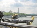 Sculpture on Alexander III bridge over Seine river and Eiffel Tower at background, Paris, France Royalty Free Stock Photo