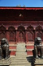 Sculpture ancient bronze napali lion singha guardian statues and carving wooden building Shiva Parvati hindu temple for people