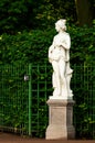 Sculpture of antique european sibyl in summer garden