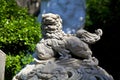 Sculpture of an Asian lion carved from stone in one of the ancient temples of Vietnam