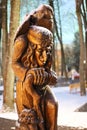 baba yaga wood sculpture with an owl in a city park russia