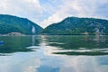 Sculpture bas-relief of the Dacian king Decebal, located on the rocky bank of the Danube in Romania. View from the coast of Serbia